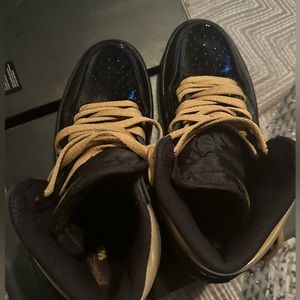 Jordan 1s, black and gold, size 8 men’s.